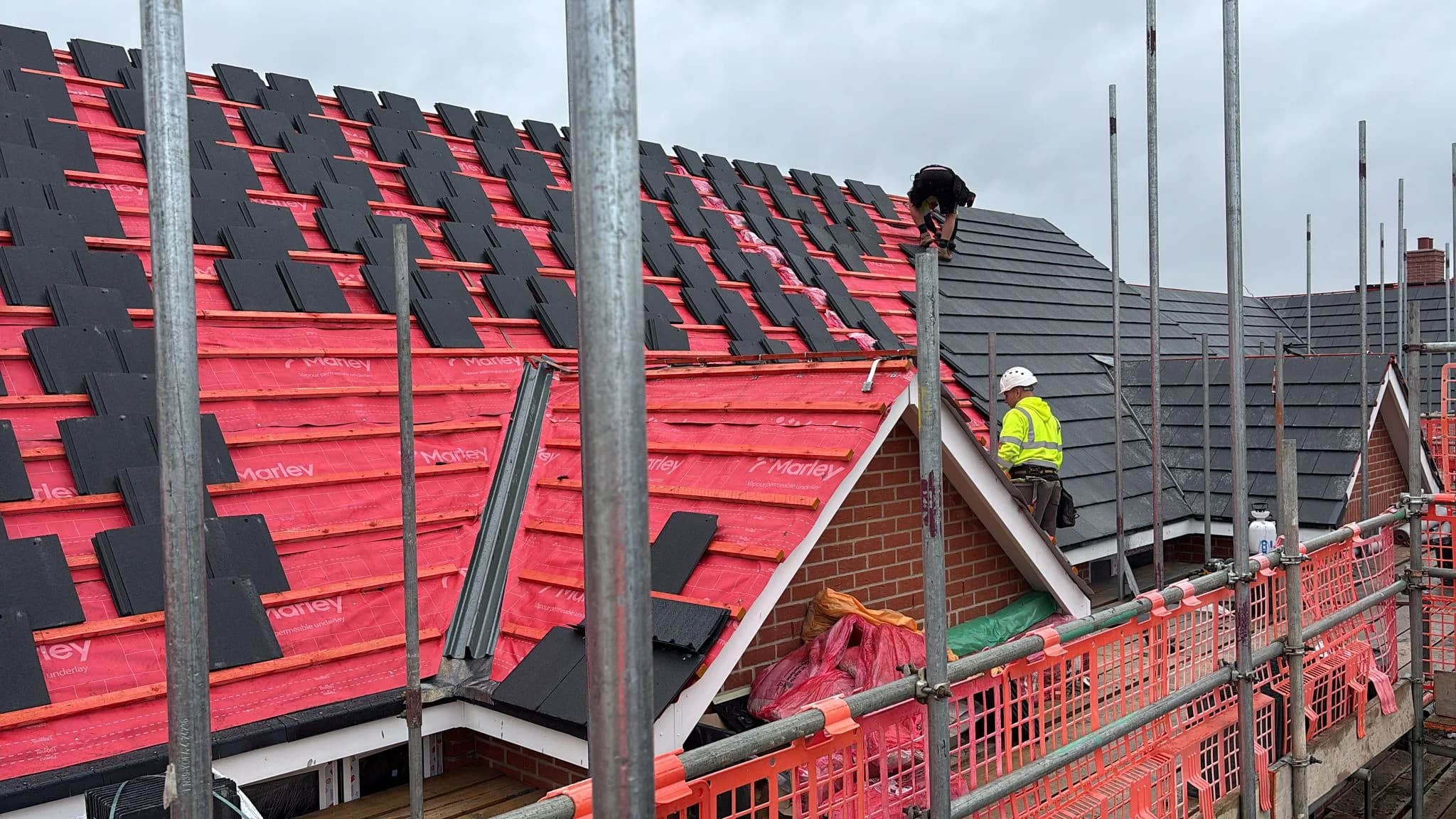 New tiled roof being laid over breathable membrane and battens
